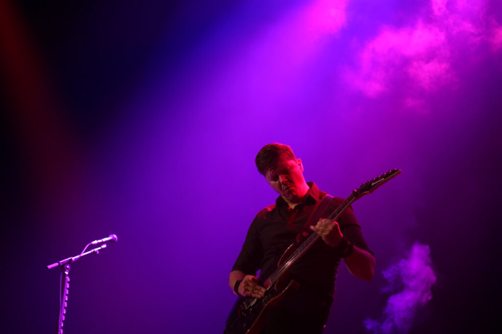 Flemming C. Lund on stage with Volbeat at the Calgary Saddledome on June 11, 2025
