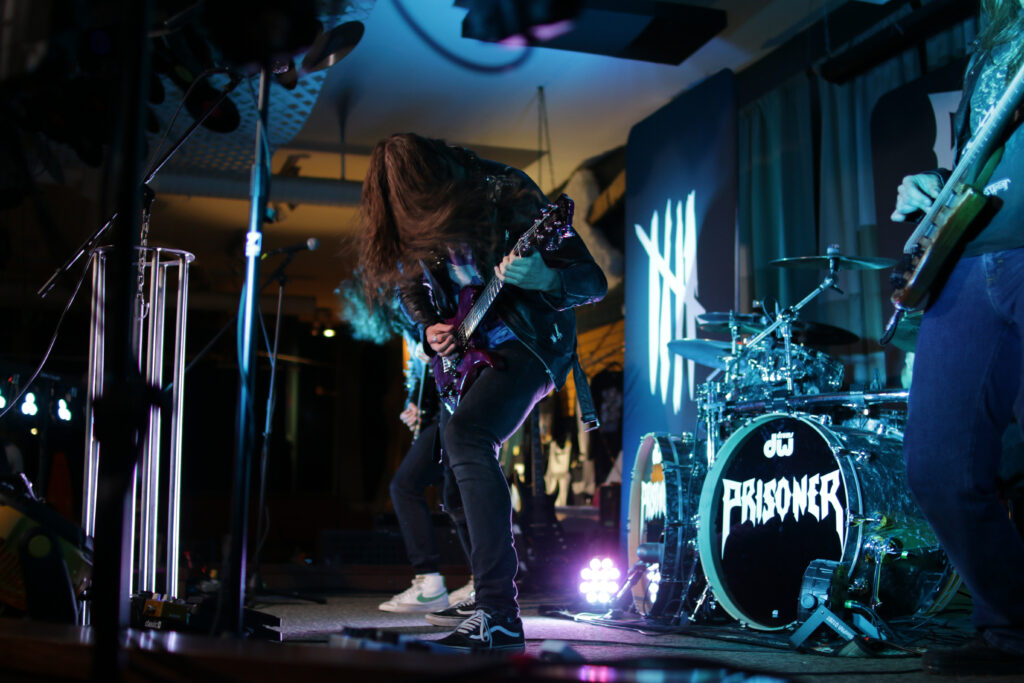 Murray Emery of the band Prisoner performing on stage at the Owl Acoustic lounge in Lethbridge, Alberta on June 6, 2025